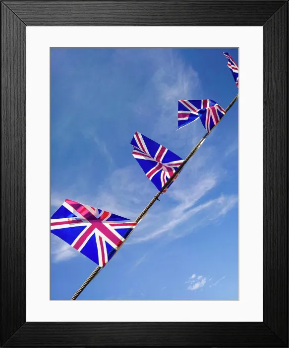 Framed Print : British Union Jack flags against a blue sky Framed Print : British Union Jack flags against a blue sky