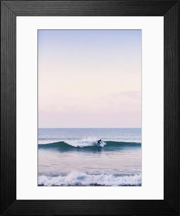 Framed Print : A young surfer off the coast of Portugal on an early January morning Framed Print : A young surfer off the coast of Portugal on an early January morning