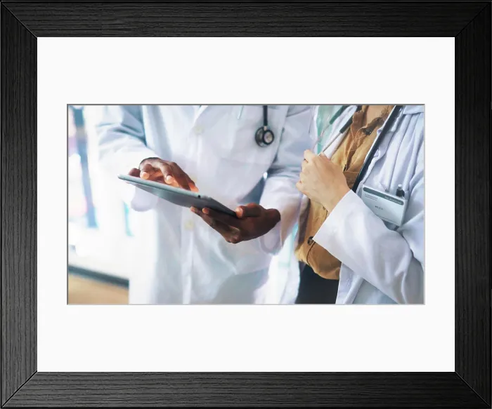 Framed Print : Collaboration, hands and tablet with doctors in hospital together for medical consulting Framed Print : Collaboration, hands and tablet with doctors in hospital together for medical consulting