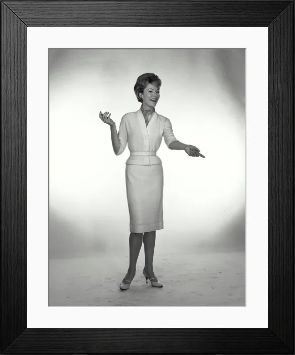 Framed Print : Vintage Photograph. A woman wearing a neckerchief tucked into a sweater, gesturing off camera Framed Print : Vintage Photograph. A woman wearing a neckerchief tucked into a sweater, gesturing off camera