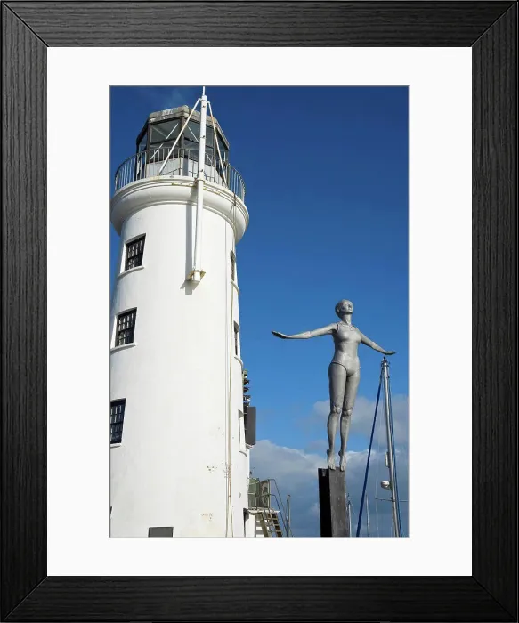 Framed Print : England, North Yorkshire, Scarborough. Figure of the Diving Belle next to Scarborough Lighthouse Framed Print : England, North Yorkshire, Scarborough. Figure of the Diving Belle next to Scarborough Lighthouse