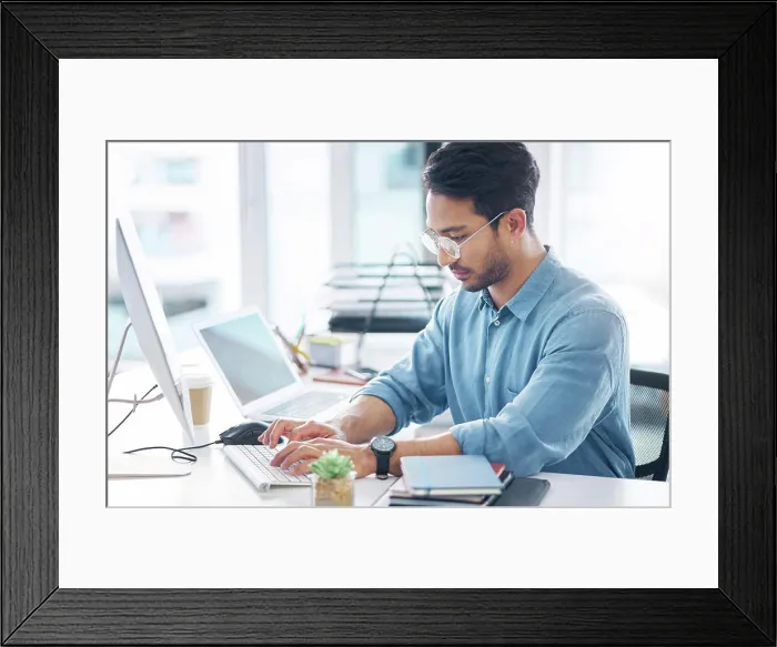 Framed Print : Serious, business man and typing on computer in office for startup management Framed Print : Serious, business man and typing on computer in office for startup management