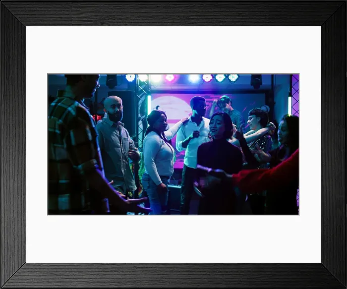Framed Print : Young partners dancing together at club Framed Print : Young partners dancing together at club