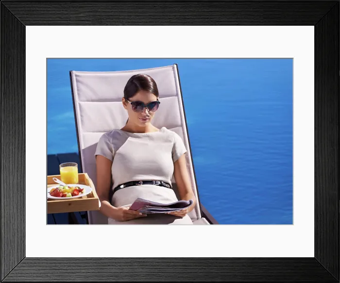 Framed Print : Woman, reading and magazine on sunbed outdoor with sunglasses for relax Framed Print : Woman, reading and magazine on sunbed outdoor with sunglasses for relax