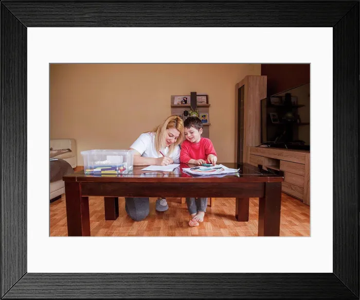 Framed Print : Mother and son drawing together at home