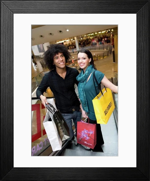 Framed Print : England, West Midlands, Birmingham. A young couple shopping in the Bullring shopping centre in Birmingham