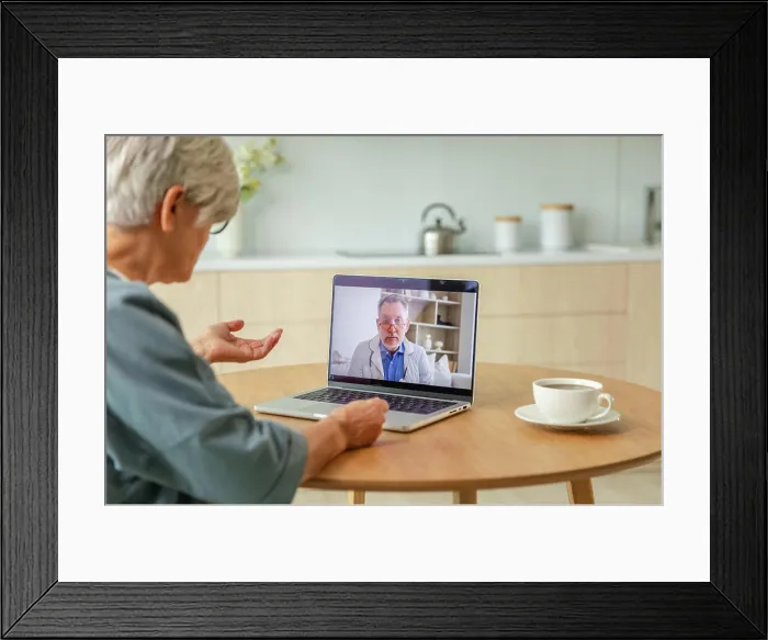 Framed Print : Senior doctor expert examine older seniors online Framed Print : Senior doctor expert examine older seniors online