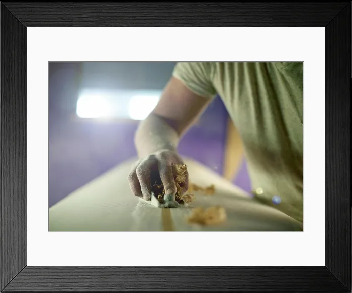 Framed Print : Manufacturing, hand and person with planer on surfboard for production process Framed Print : Manufacturing, hand and person with planer on surfboard for production process