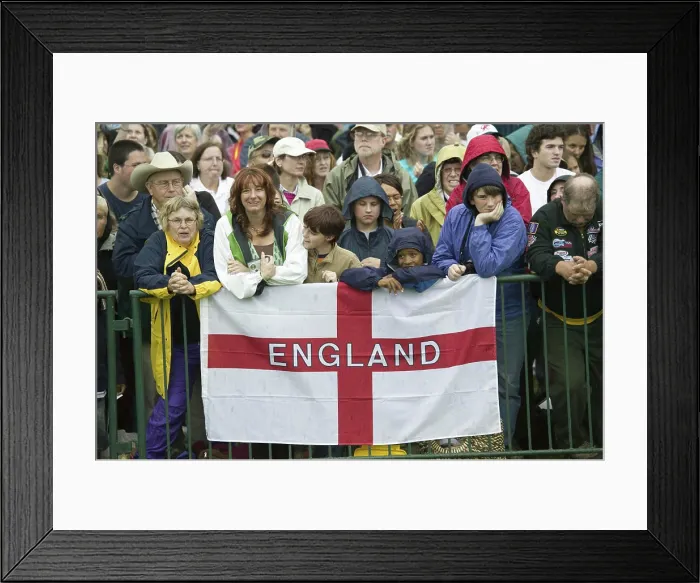 Framed Print : Onlooker displaying English Flag, St