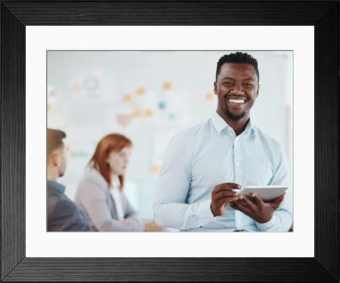 Framed Print : Leadership, motivation and business man planning on digital tablet and looking proud in a group meeting Framed Print : Leadership, motivation and business man planning on digital tablet and looking proud in a group meeting