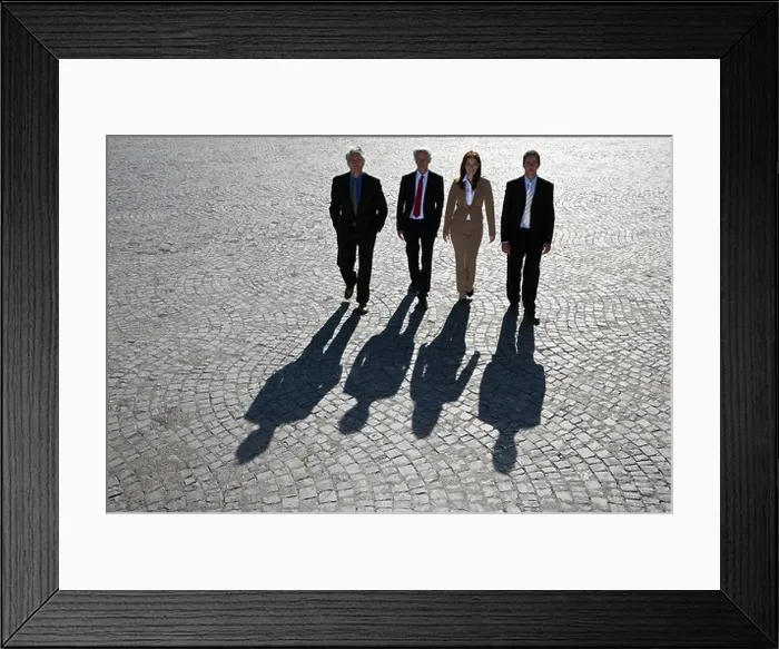 Framed Print : Business people walking on cobbled road Framed Print : Business people walking on cobbled road