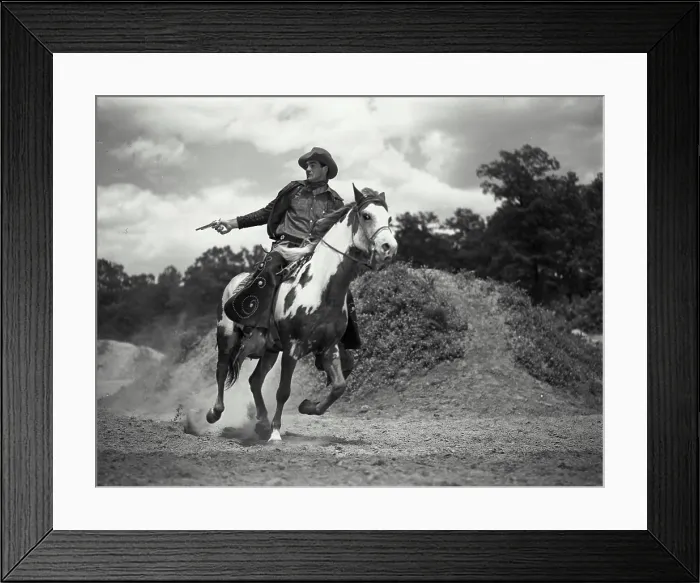 Framed Print : Vintage Photograph. Man in chaps riding on horses back shooting gun. Frame 2 Framed Print : Vintage Photograph. Man in chaps riding on horses back shooting gun. Frame 2