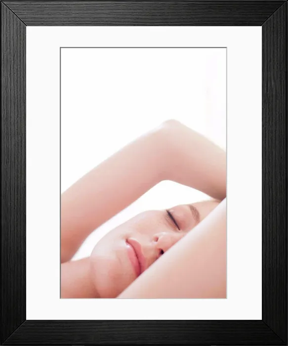 Framed Print : MODEL RELEASED. Young woman resting