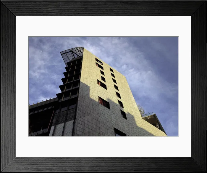 Framed Print : Low angle view of commercial building against cloudy sky, Singapore, China. 06 / 08 / 2008 Framed Print : Low angle view of commercial building against cloudy sky, Singapore, China. 06 / 08 / 2008