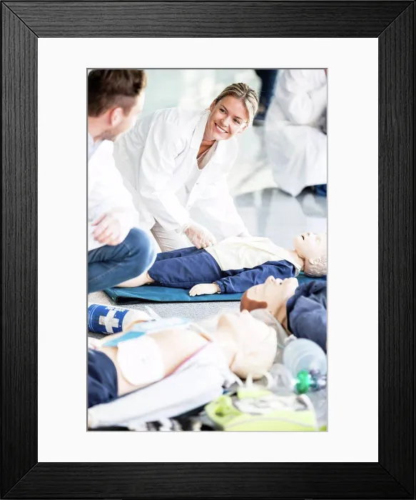 Framed Print : Doctors undertaking CPR training Framed Print : Doctors undertaking CPR training