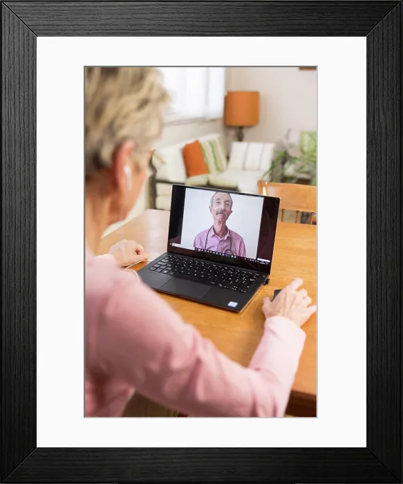 Framed Print : Senior woman teleconsulting from home Framed Print : Senior woman teleconsulting from home