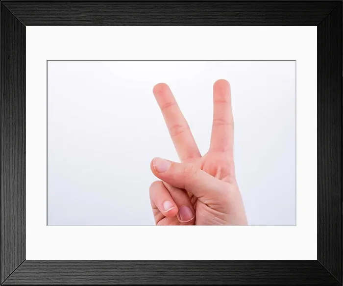 Framed Print : Hand making Victory Symbol on a white background
