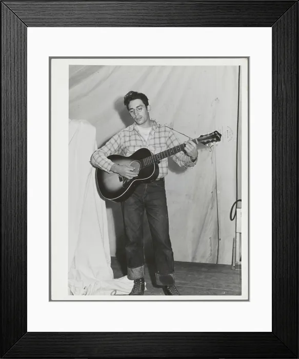 Framed Print : Singing cowboy songs at entertainment at the FSA (Farm Security Administration) mobile camp for migratory farm workers