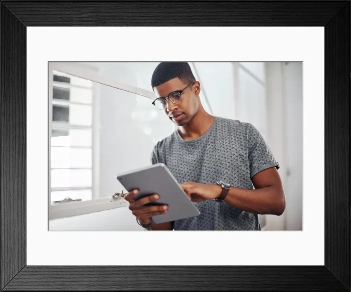 Framed Print : Tablet, business and black man research online for information or networking in startup office Framed Print : Tablet, business and black man research online for information or networking in startup office