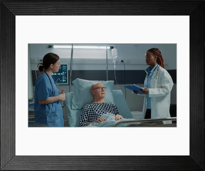 Framed Print : Nurse checking oximeter on sick patient in hospital ward Framed Print : Nurse checking oximeter on sick patient in hospital ward