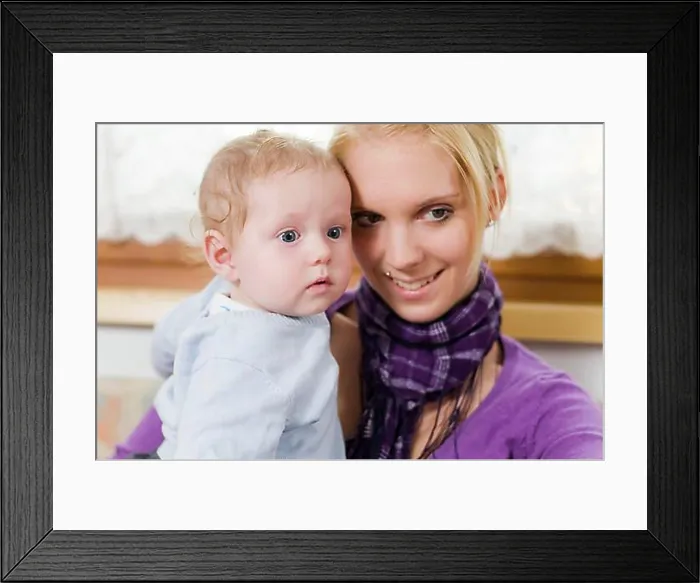 Framed Print : Young mother having fun with her toddler in her arms Framed Print : Young mother having fun with her toddler in her arms