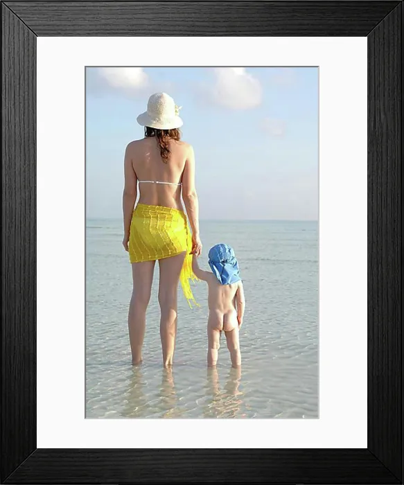 Framed Print : Mother and small child standing in shallow water Framed Print : Mother and small child standing in shallow water