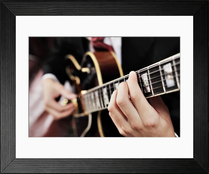 Framed Print : Guitarist Jazz musician playing with electric guitar. Short depth-of-field. Copyright: xZoonar.com / J.xSandvikx 3082975