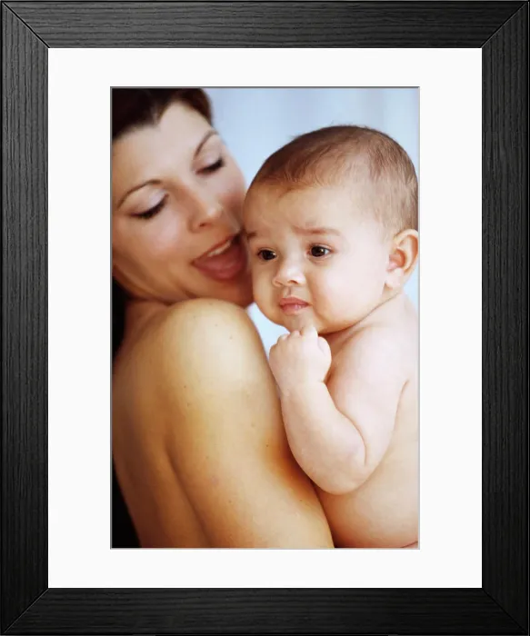 Framed Print : Side profile of a mother holding her baby boy in her arms Framed Print : Side profile of a mother holding her baby boy in her arms