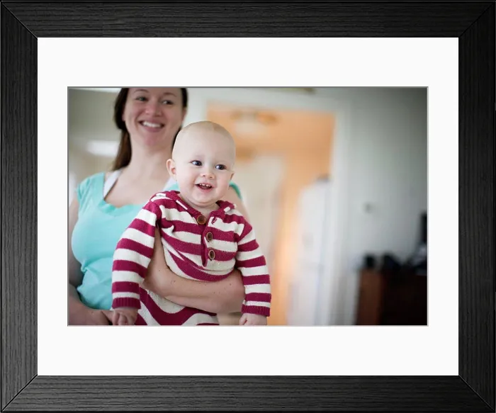 Framed Print : Happy mother holding her smiling young baby Framed Print : Happy mother holding her smiling young baby