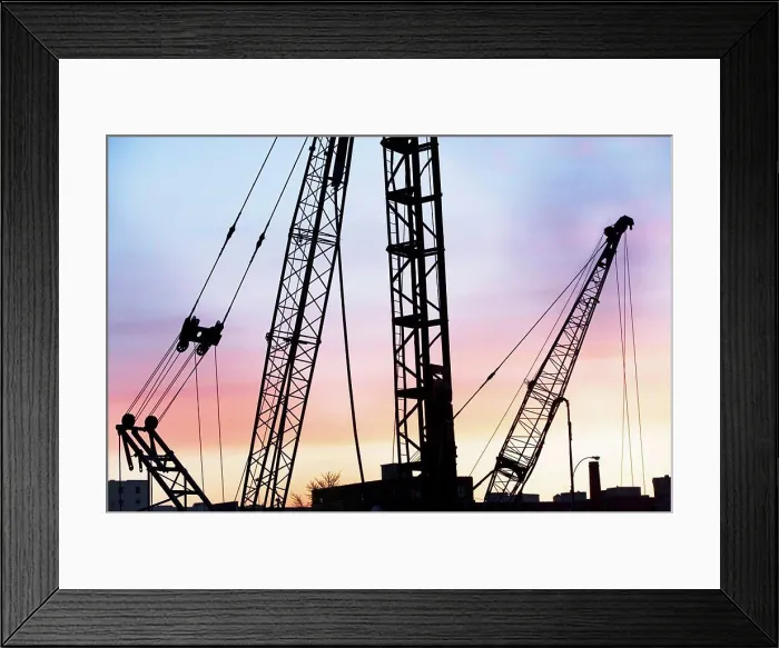 Framed Print : Construction cranes at sunset Framed Print : Construction cranes at sunset