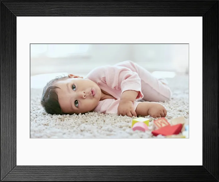 Framed Print : Baby, face and relax on carpet in home with building blocks for cognitive development Framed Print : Baby, face and relax on carpet in home with building blocks for cognitive development