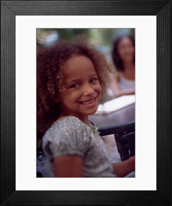 Framed Print : Portrait of a girl smiling Framed Print : Portrait of a girl smiling