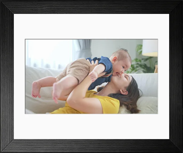 Framed Print : A tiny child smiling happily on the couch in the living room with mom A tiny child smiling happily on the couch Framed Print : A tiny child smiling happily on the couch in the living room with mom A tiny child smiling happily on the couch