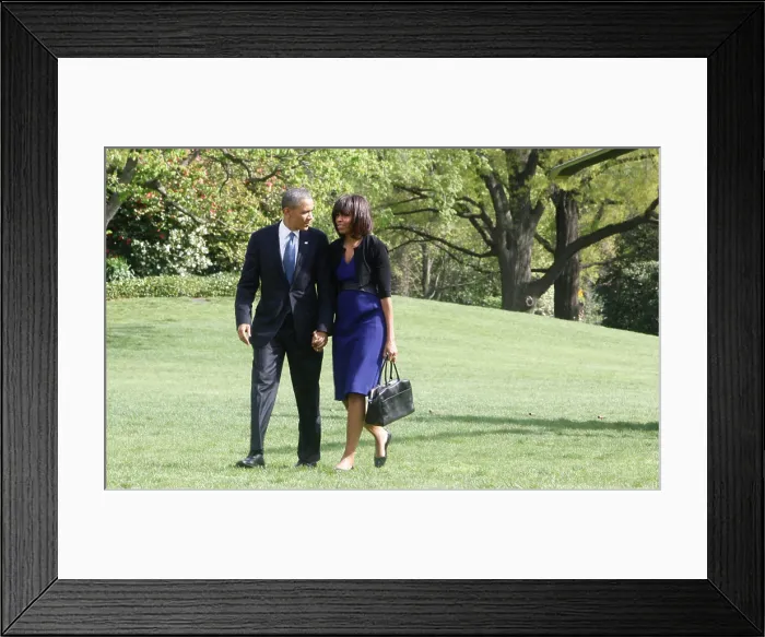 Framed Print : President Barack Obama and First Lady Michelle Obama arrive at the White House on April 18, 2013