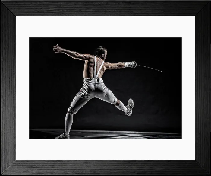 Framed Print : American World Champion and two time Olympic Fencer Soren Thompson against a dark background. Bodies in Action Framed Print : American World Champion and two time Olympic Fencer Soren Thompson against a dark background. Bodies in Action