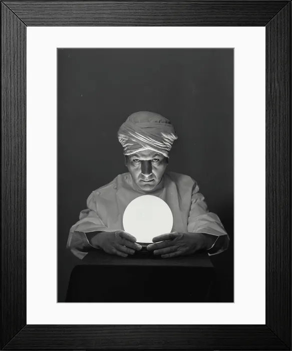 Framed Print : Vintage Photograph. Fortune teller with glowing crystal ball on table Framed Print : Vintage Photograph. Fortune teller with glowing crystal ball on table