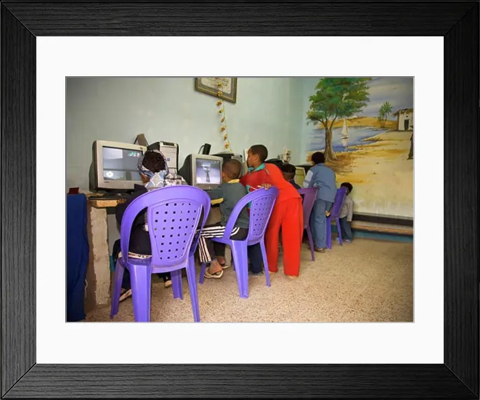 Framed Print : Young african children playing on computers in a village in Nubia near Aswan Egypt North Africa Framed Print : Young african children playing on computers in a village in Nubia near Aswan Egypt North Africa