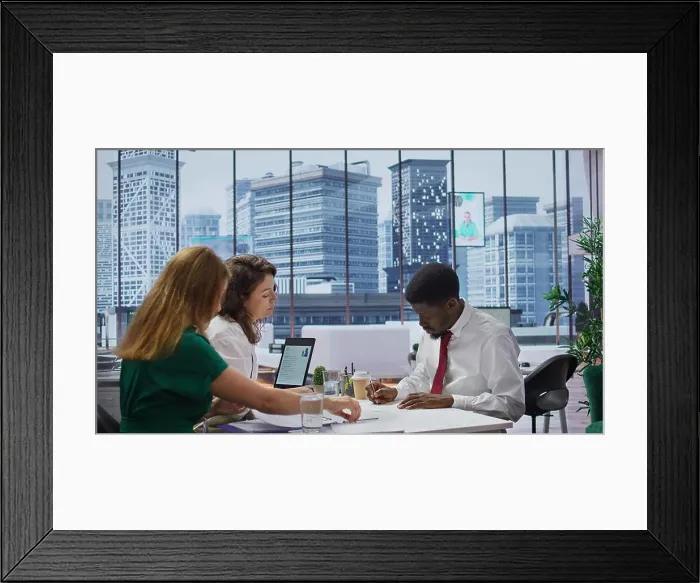Framed Print : Male job candidate filling in his application form in high end office Framed Print : Male job candidate filling in his application form in high end office