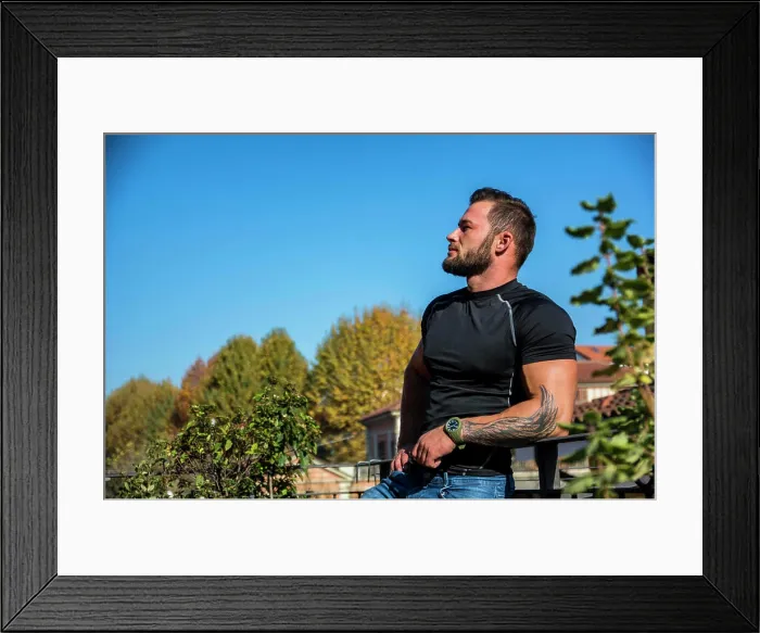 Framed Print : Handsome dark haired young man looking out on the view Handsome dark haired young man standing in a balcony Framed Print : Handsome dark haired young man looking out on the view Handsome dark haired young man standing in a balcony