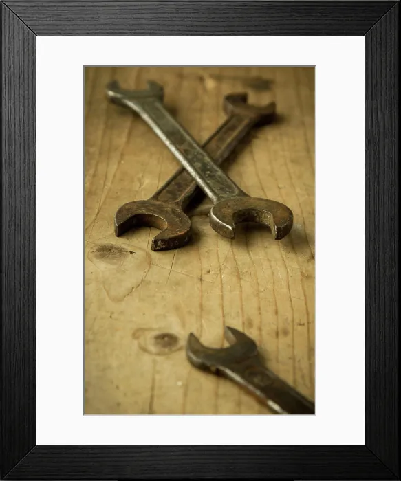 Framed Print : old open end wrenches old vintage retro used open-end wrenches on wooden table Copyright: xZoonar