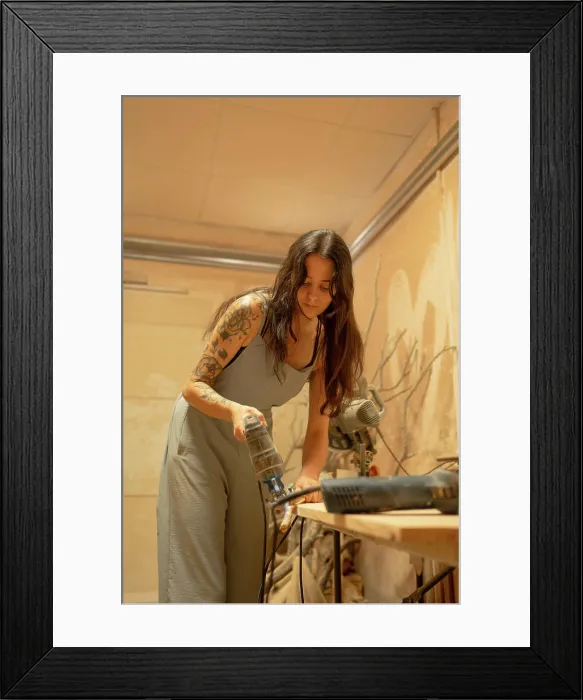 Framed Print : Carpenter using electric saw cutting wood plank in workshop Framed Print : Carpenter using electric saw cutting wood plank in workshop