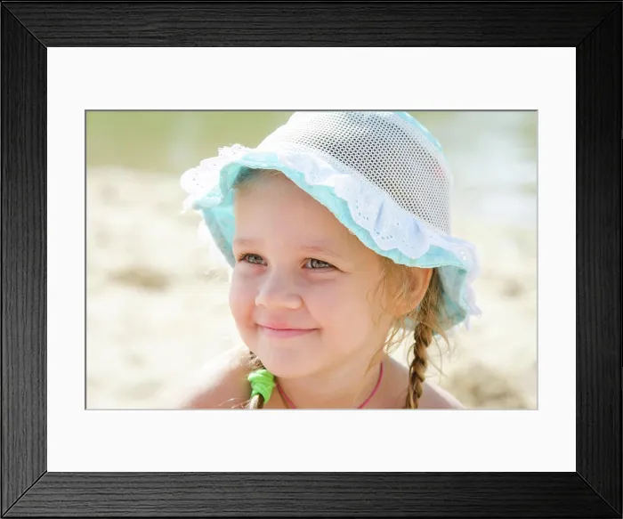 Framed Print : Portrait of a cheerful little girl on the beach in panama Close-up portrait of a happy girl Europeans in panama Framed Print : Portrait of a cheerful little girl on the beach in panama Close-up portrait of a happy girl Europeans in panama