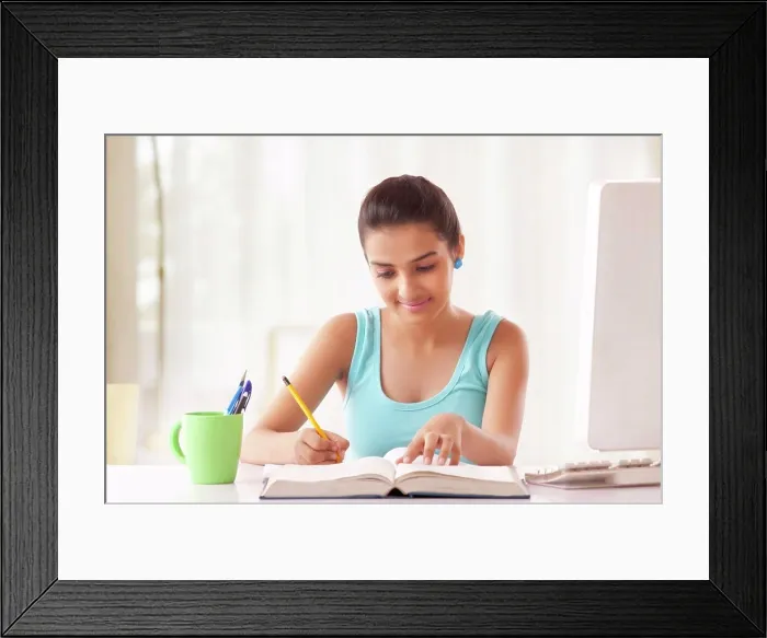 Framed Print : Portrait of Teenage Girls student studying at the table