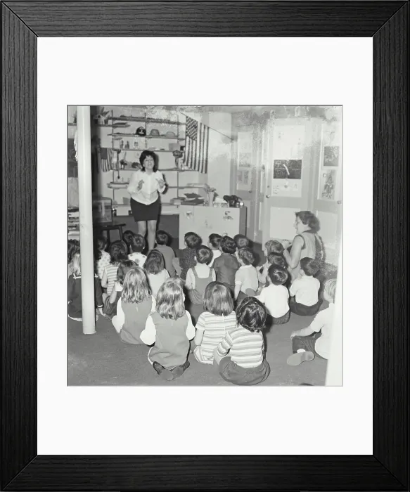 Framed Print : Vintage Photograph. A teacher singing in a small elementary school class