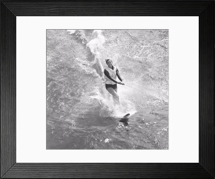 Framed Print : Waterskiing in the 1960s. A young woman is waterskiing. Sweden July 1964 Framed Print : Waterskiing in the 1960s. A young woman is waterskiing. Sweden July 1964