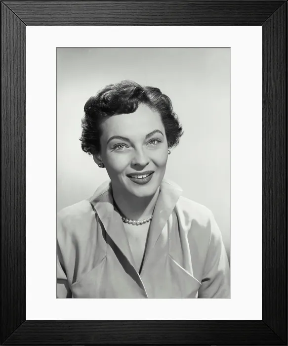 Framed Print : Vintage photograph. Portrait of Woman with short hair smiling at camera