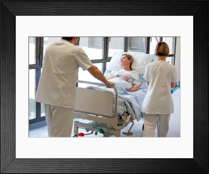 Framed Print : Woman lying on a stretcher. Limoges hospital, France Framed Print : Woman lying on a stretcher. Limoges hospital, France