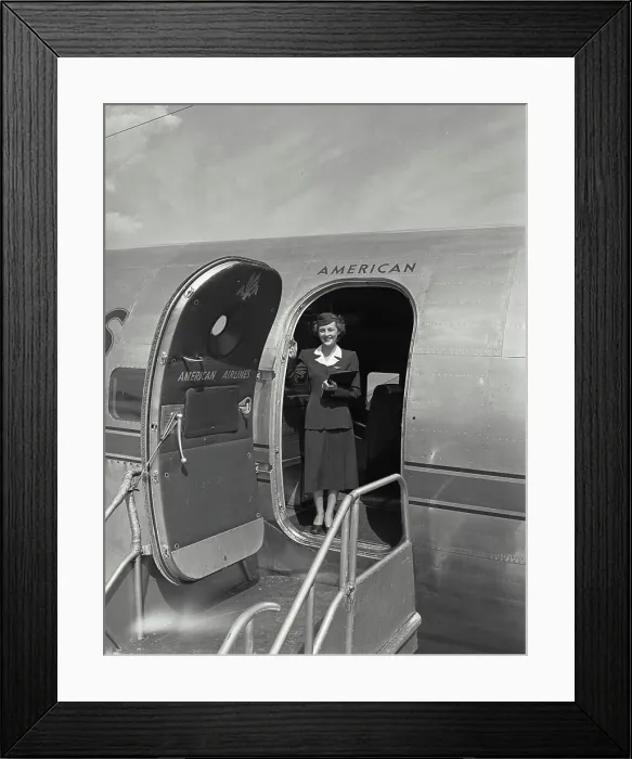 Framed Print : Vintage photograph. American airlines stewardess standing in plane doorway Framed Print : Vintage photograph. American airlines stewardess standing in plane doorway