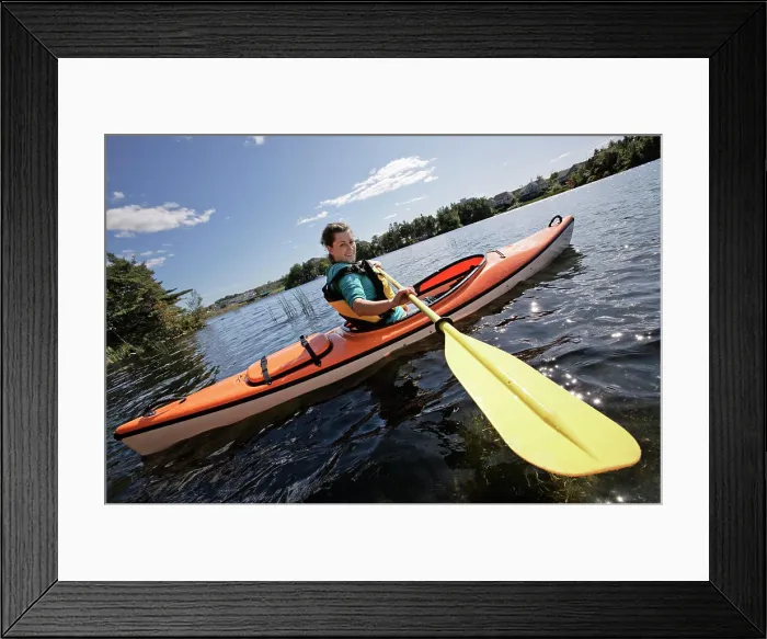 Framed Print : Woman kayaking on Lake Micmac in Dartmouth, Nova Scotia, part of Halifax Regional Municipality Framed Print : Woman kayaking on Lake Micmac in Dartmouth, Nova Scotia, part of Halifax Regional Municipality
