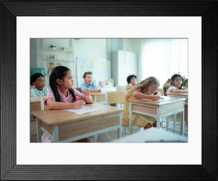 Framed Print : Students learn and study in a classroom of school where youngsters sit and listen attentively Framed Print : Students learn and study in a classroom of school where youngsters sit and listen attentively